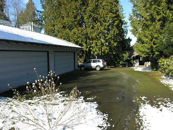 4 car garage with more parking.