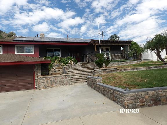 Front view with stone entry steps up to the front entry.