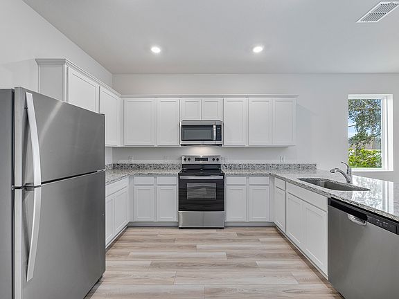 This move-in ready home features gorgeous granite countertops in the kitchen