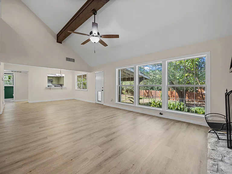 Living and dining area with backyard view. Lots of natural light throughout the day.