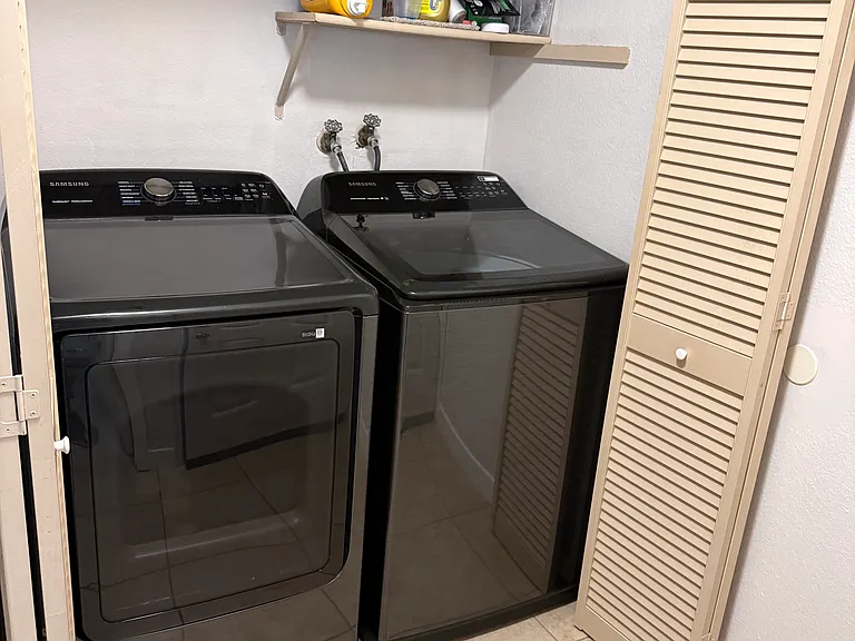 New washer and dryer with storage shelving
