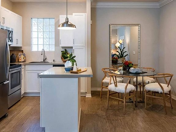 Island Kitchen with Breakfast Bar and Adjacent Dining Space