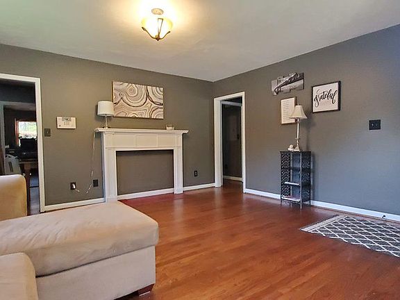 Front Door entry into the Family Room with sectional sofa & Cafe Table