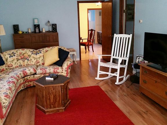 View from living room to dining room. Door closes for privac