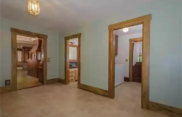 Large mudroom/playroom between garage and kitchen with 1/2 bath and separate laundry room with washer & dryer