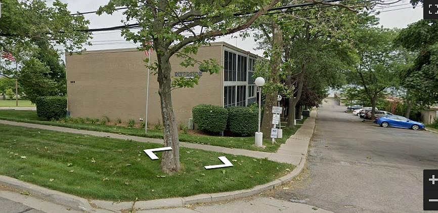Curb to building.
