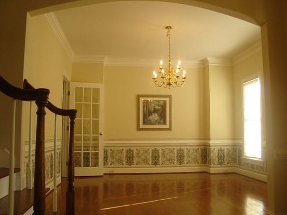 Formal Dining Room with Arched entry, hardwood floors