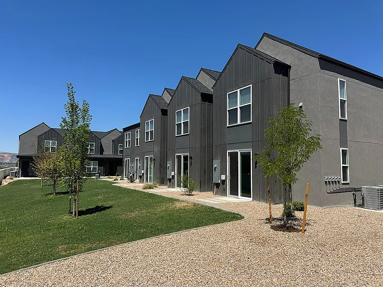 Explore the sleek architecture and serene environment of these modern townhouses.
