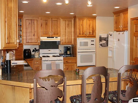 Newly tiled kitchen floor. Granite counters  and custom cabinets.