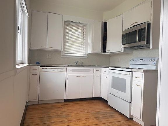 Kitchen with dishwasher and microwave