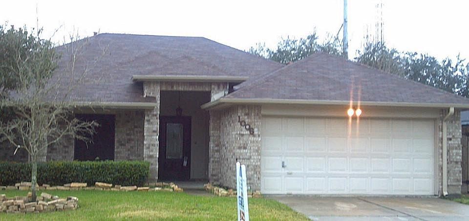 Landscaped front yard with covered entry.