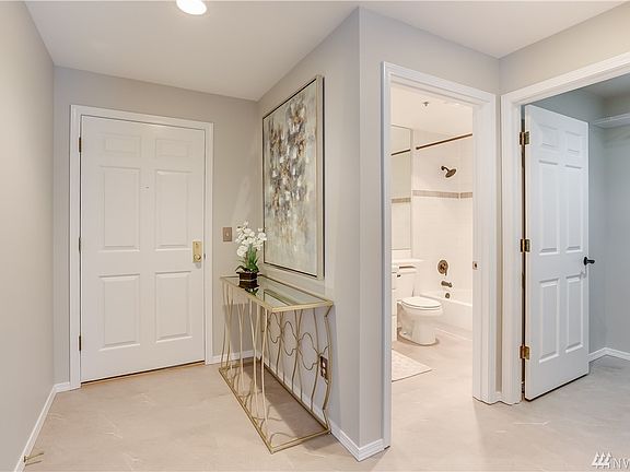 Charming entryway with fresh paint throughout and new flooring with the main bath perfectly placed for guests or your roommate!.