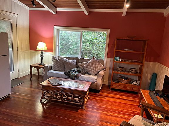 late afternoon partial kitchen, sitting area with west door to private porch, actual rich color(zillow copy fades actual)