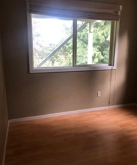 third bedroom in the middle floor next to the laundry room and family room and the third bathroom