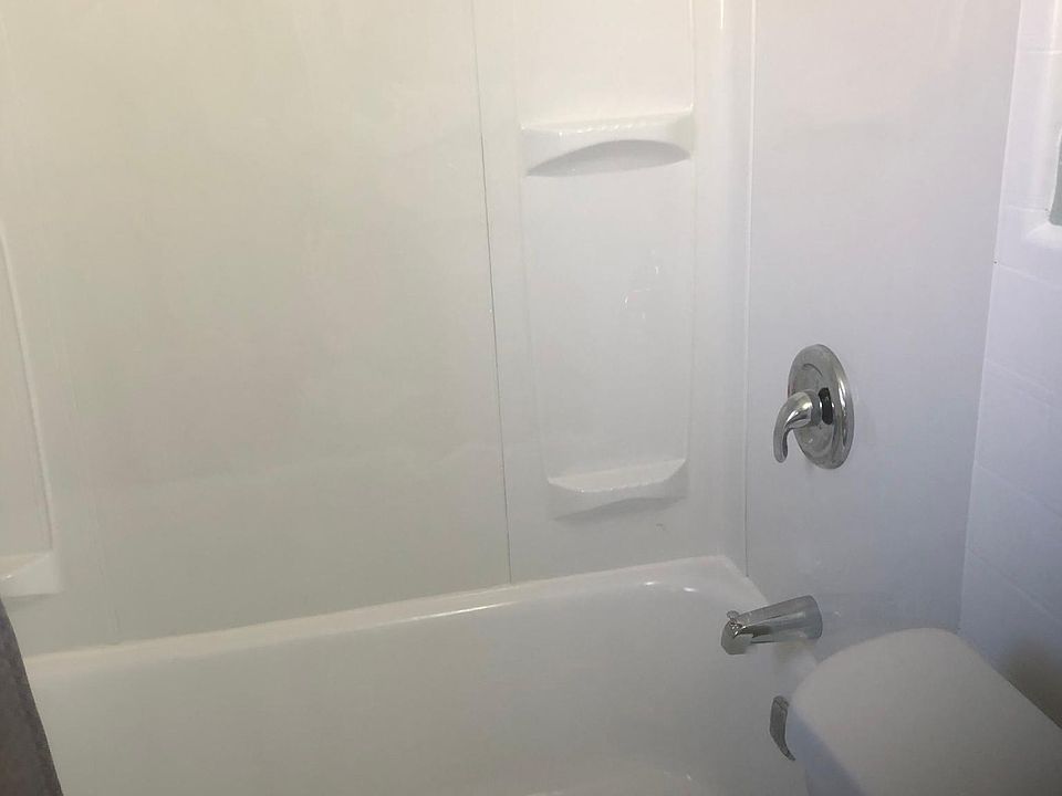 Newly glazed tub, new surround, new toilet, new vanity