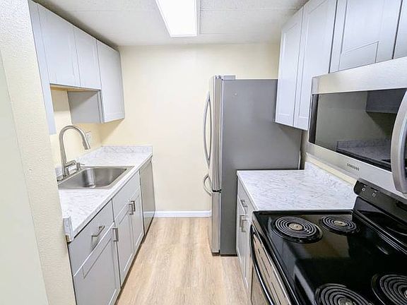 Unit 413 New Kitchen with Stainless Steel appliances including dishwasher