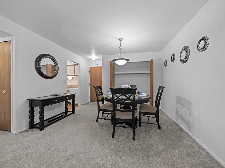 Cozy dining room connected to kitchen at Westwood Village Apartments in Westland, MI