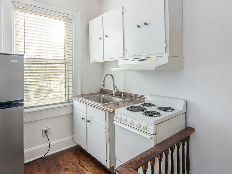 Kitchen with stove and refrigerator (no dishwasher or microwave included)