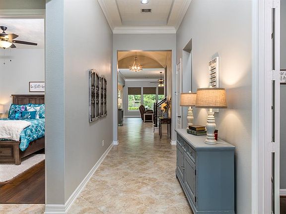 A private study with double French doors is to your right when you enter, and two large secondary bedrooms with jack-n-jill bath are to the left! All of these rooms are quiet and peaceful, being away from the main part of the home.