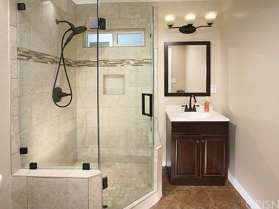 Sumptuously remodeled bathrooms, one with modern v