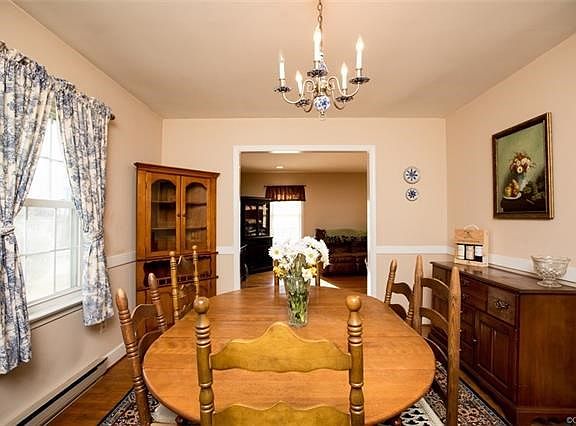 Dining room has wood floors and is off of living room and kitchen.  Come enjoy family dinners here.