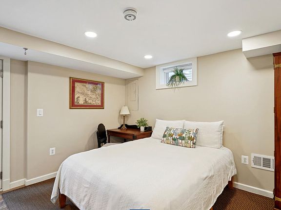 Bedroom, queen bed, desk & chair, and closet,