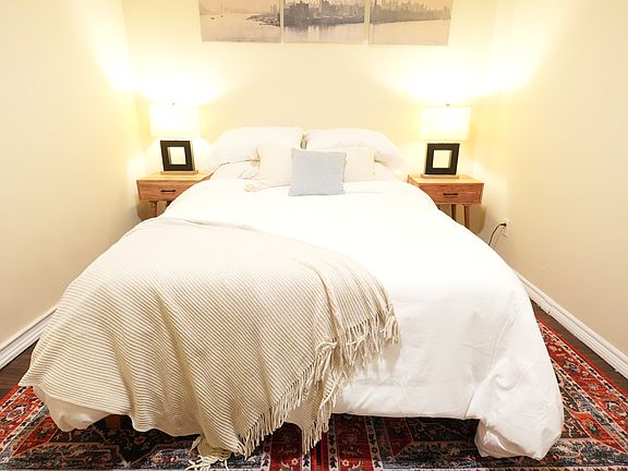 Second bedroom includes as 12" memory foam full bed with shelving storage for clothes