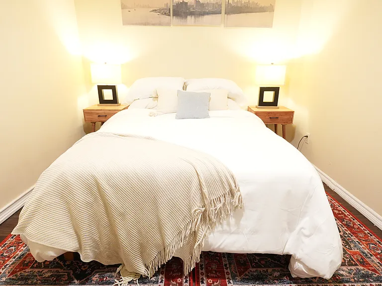 Second bedroom includes as 12" memory foam full bed with shelving storage for clothes