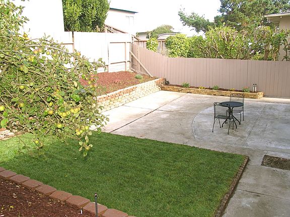 Landscaped yard with automatic sprinkler system