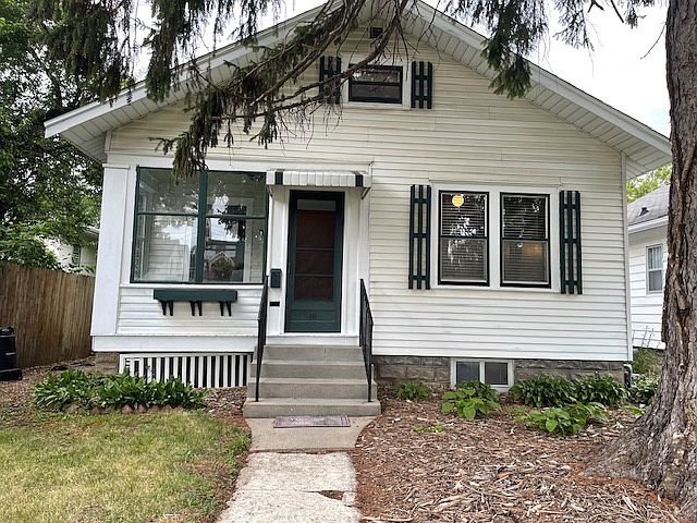 Front of home. Porch has glass windows but the door is only screened. The windows on the right of home is main bedroom.