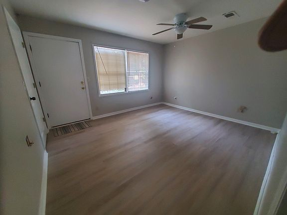 Spacious den that can be converted into a home office with an exterior door.