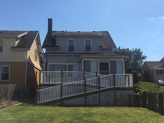 Backyard with deck and enclosed porch