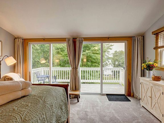 Master with balcony deck and view of the lake.