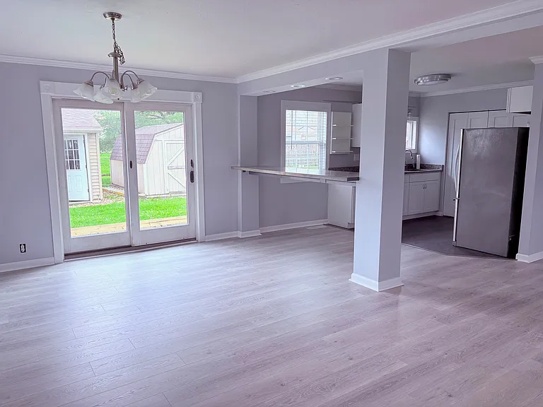 Dining/Kitchen View from side door, new flooring, new windows, fresh paint