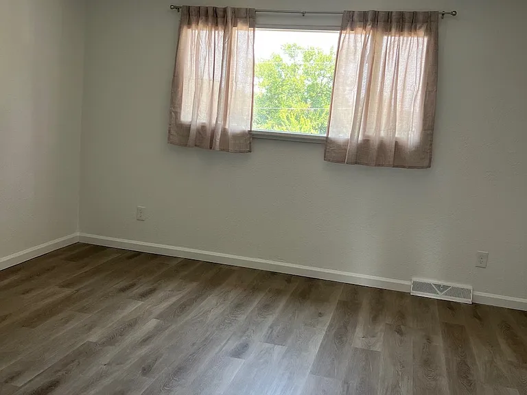 Upstairs primary bedroom, north facing window.