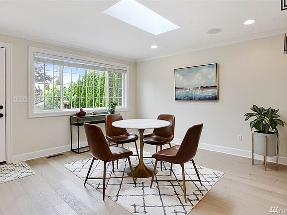 Bright dining area, skylight, built-in Bose speakers throughout the common areas, new engineered hardwoods and new carpet, 2" mini-blinds.