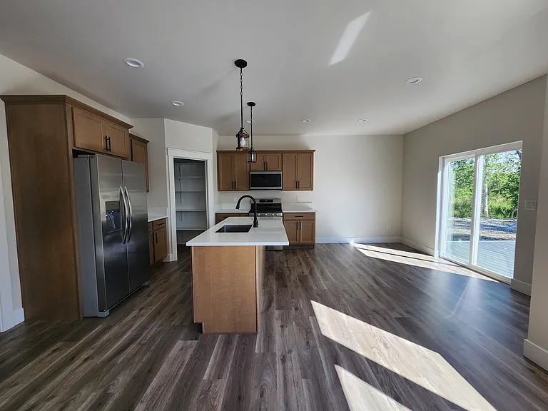 Kitchen and dining area welcoming lots of natural light