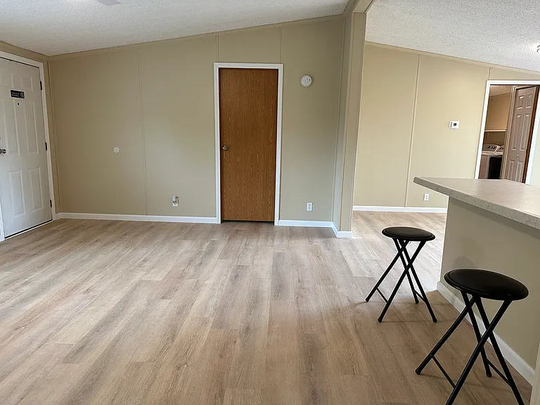 Great room and door to primary bedroom