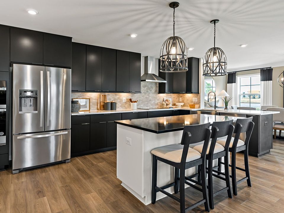 The kitchen in the Carnegie II floor plan is sleek, stylish, and functional, with a spacious island.