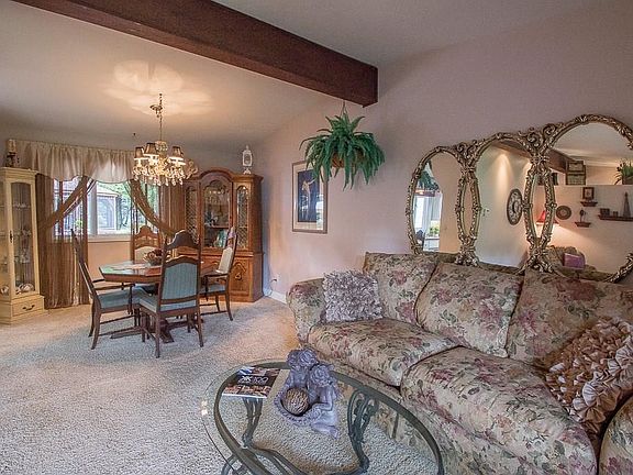 The Dining Room is located off the Kitchen, featuring views of the beautiful backyard.