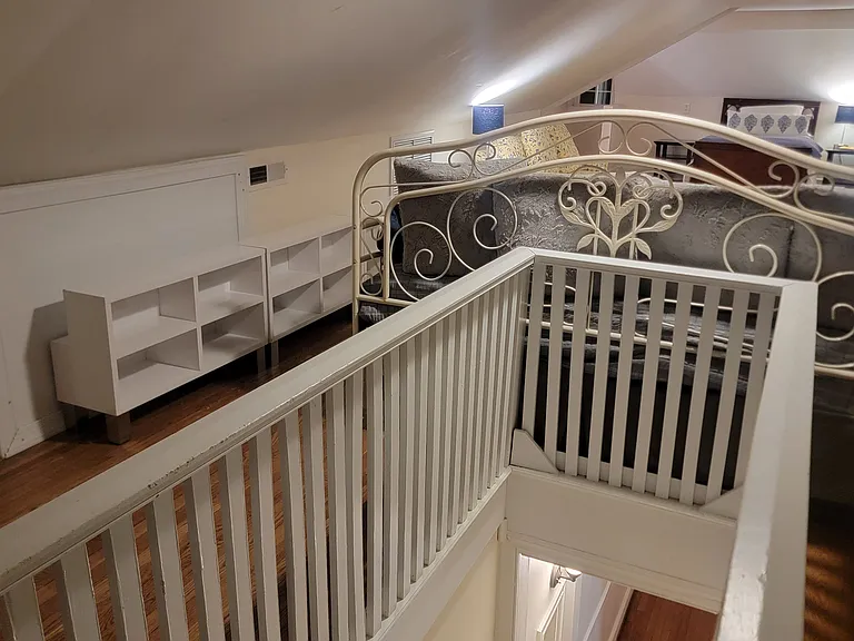Upstairs bedroom with two single beds.
