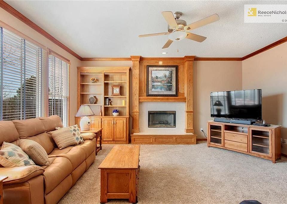 Family Room.  Built-In cabinets; fireplace; new carpet in 2018