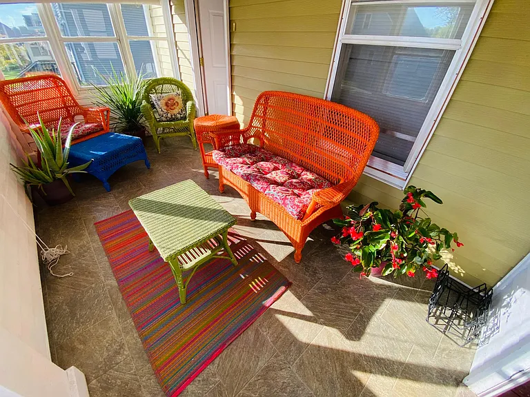 Plants and tenants love the enclosed sun porch!