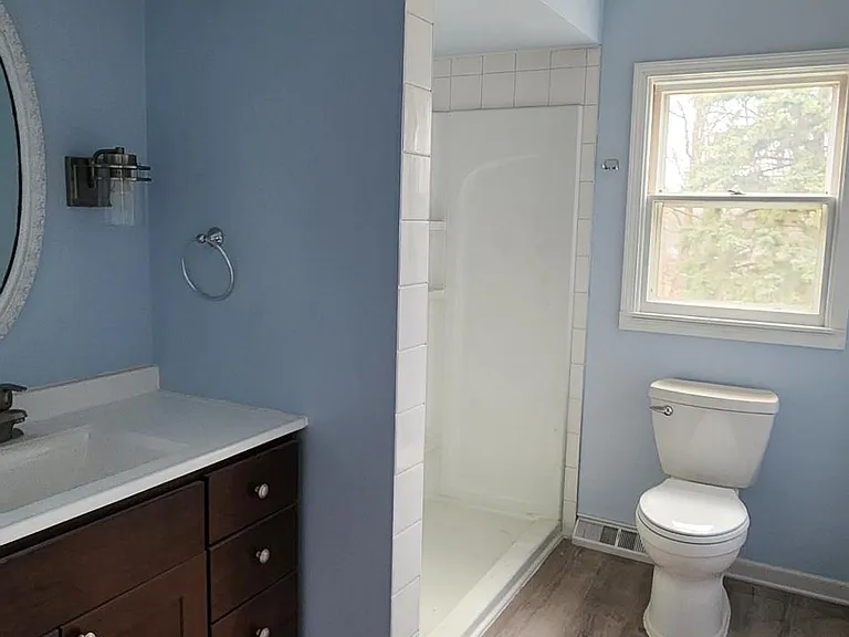 Main floor full bathroom and laundry room. Brand new washer and dryer not in picture but it is included