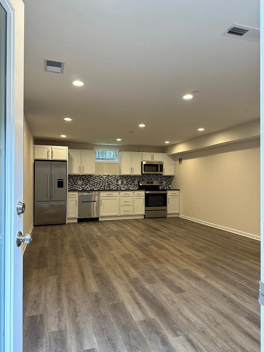 View of common area and kitchen from entry door - 4424B Brandywine St NW