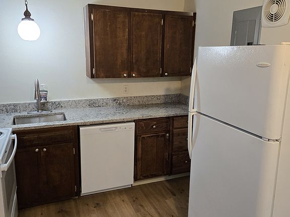 Kitchen with new fridge and new countertops.