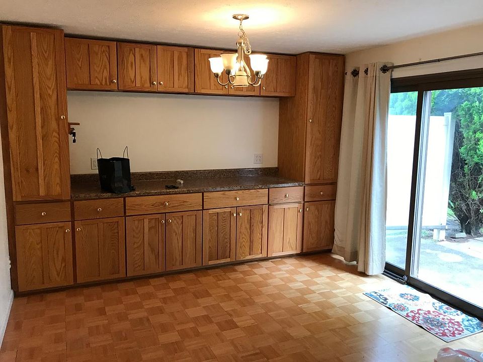 Wall to wall kitchen cabinets in eat in kitchen