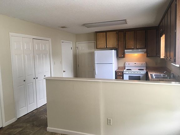 Kitchen and laundry behind by fold doors.