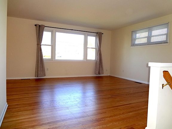 Living Room (new polished floors and draperies)