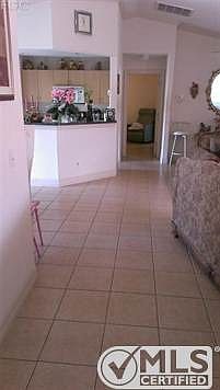 hallway showing tile throughout